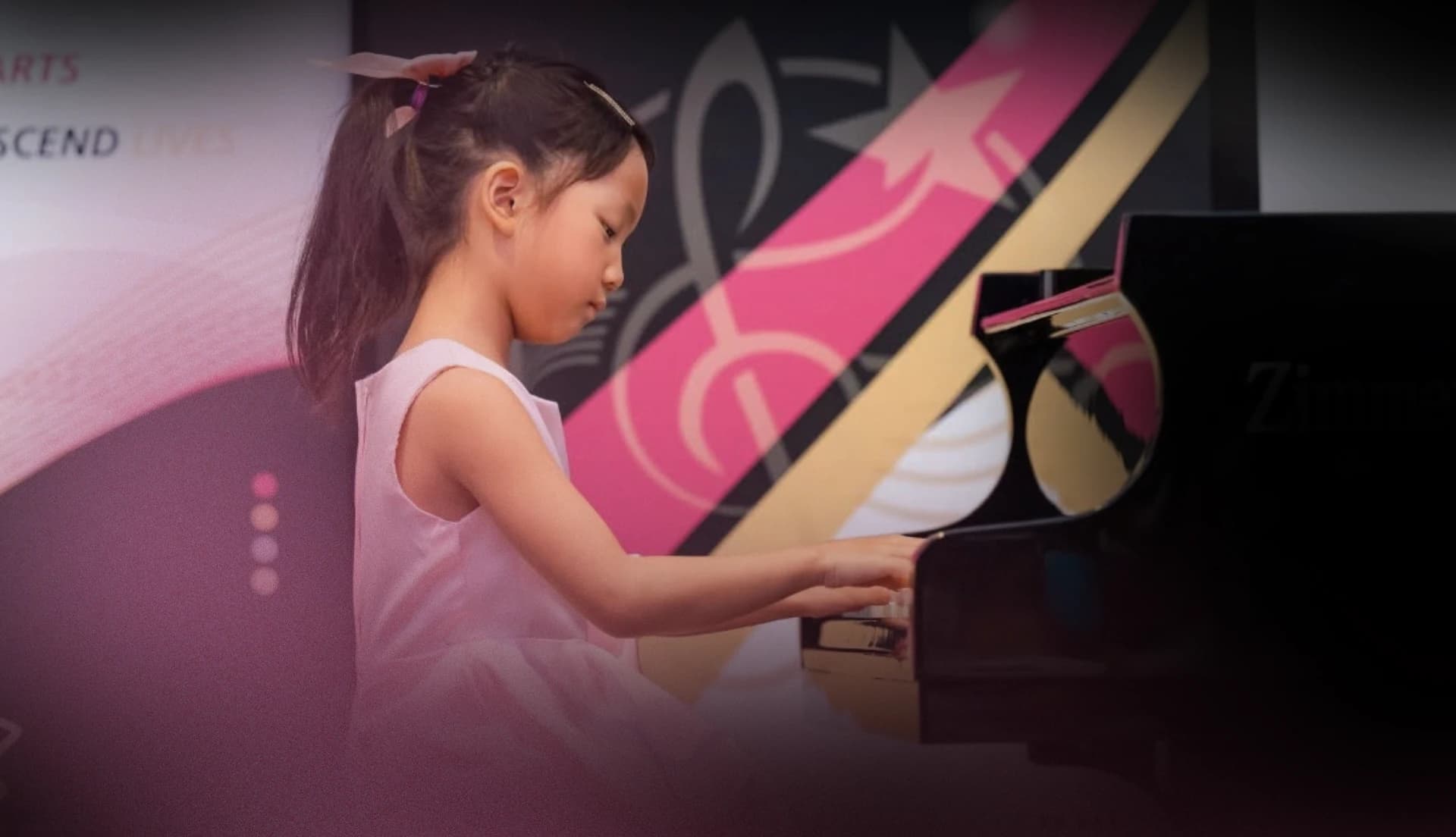 A young pianist performing at Gold Star Music Festival