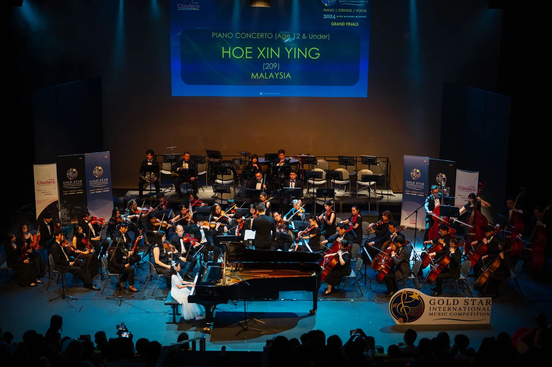 A pianist performing with The klpac Orchestra during the 2024 Competition programme